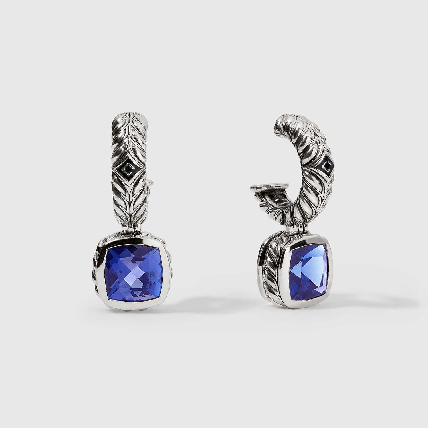 Daneila Léon silver Persian Shield leaf earrings with 5.31 carat cushion-cut lab-grown blue sapphire pair