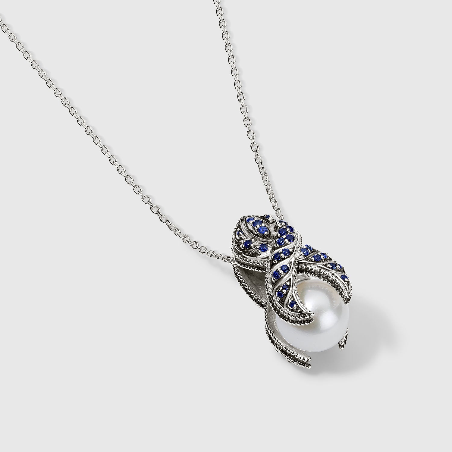 Daneila Léon silver Persian Shield leaf pendant with lab-grown diamonds, natural blue sapphires, and 17-inch silver chain