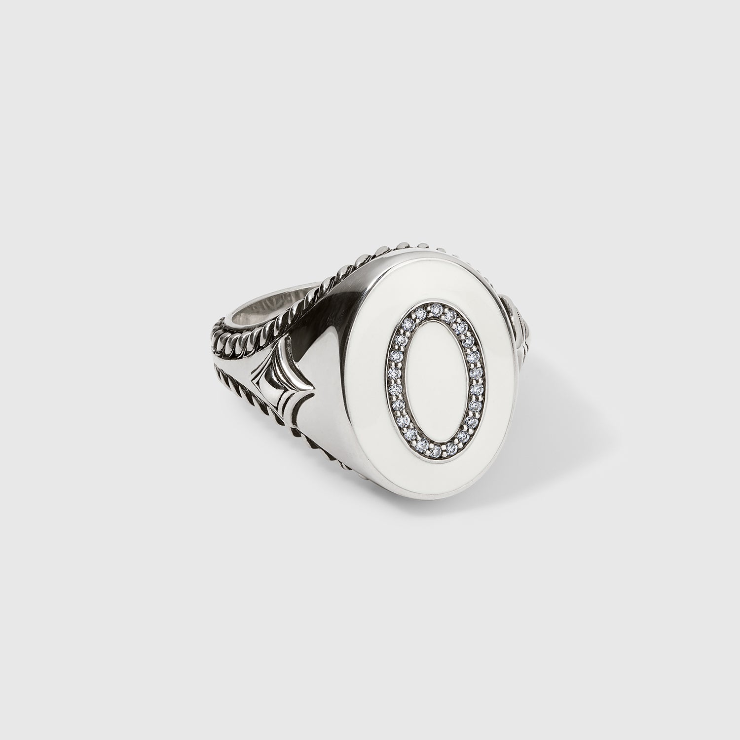 Daneila Léon sterling silver signet ring with Persian Shield leaf design, natural white diamonds, and ivory-colored enamel