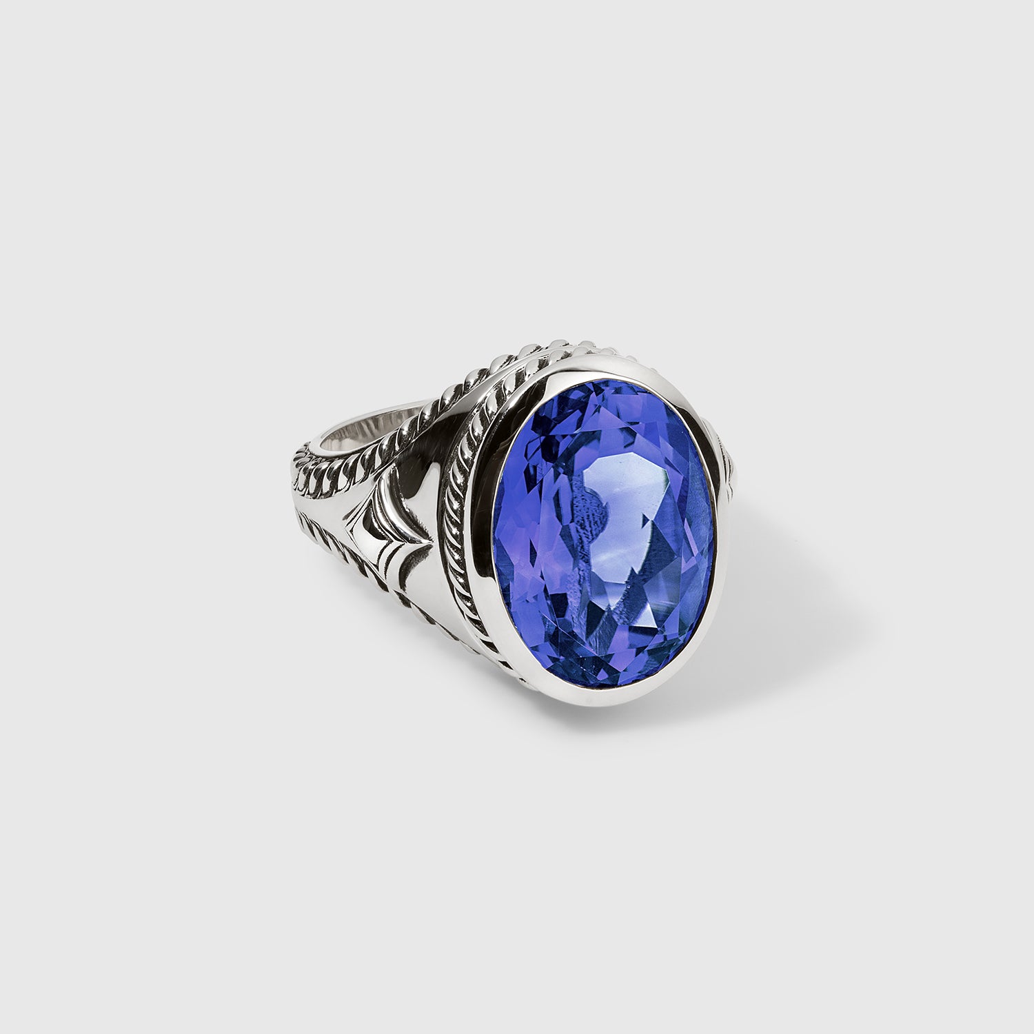 Daneila Léon silver signet ring with Persian Shield leaf design and lab-grown blue sapphire