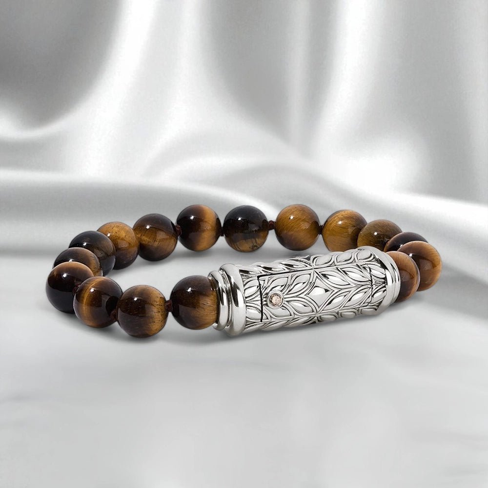 Yellow Tiger Eye interchangeable bracelet strand with sculpted Persian Shield silver clasp and diamond accents, displayed on white satin with tagline “One Clasp. Endless Possibilities.”