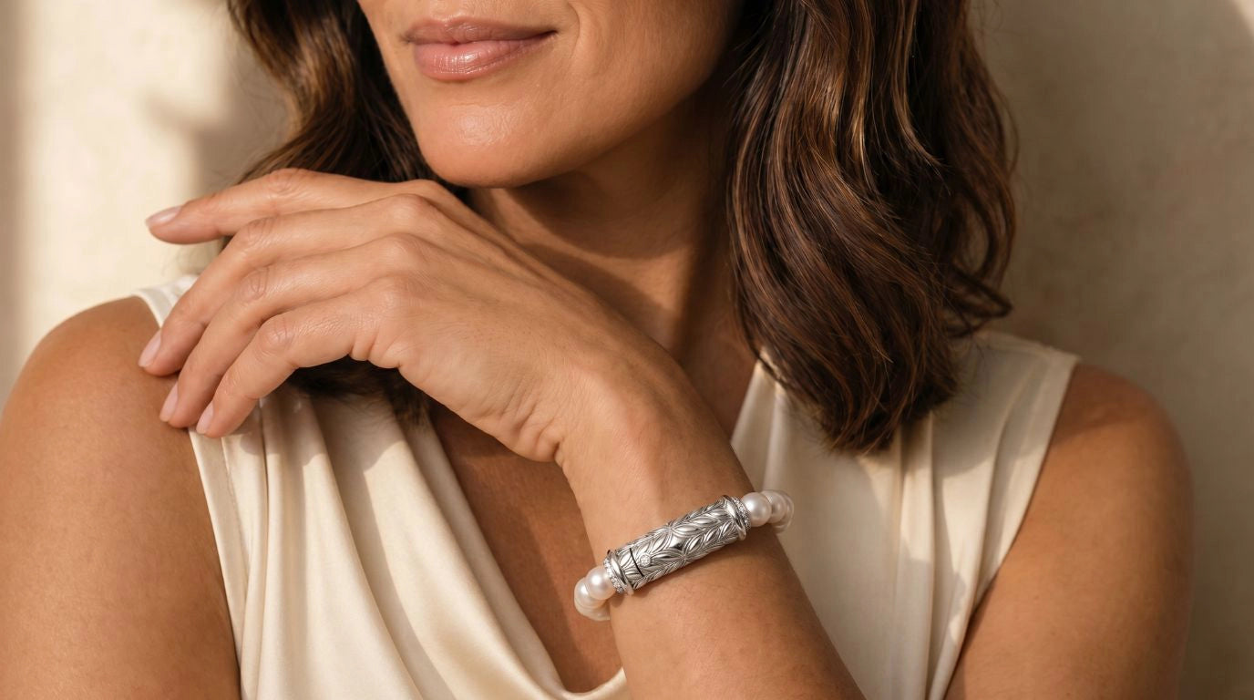 Woman wearing Persian Shield Pearl and Diamond Bracelet in sterling silver, luxury jewelry by Daneila Léonslider_item_UFaDBy