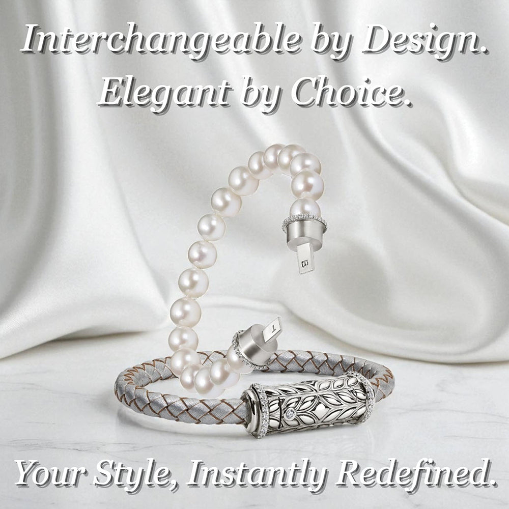 Interchangeable sterling silver bracelet with pearl strand and Persian Shield clasp, displayed on white satin fabric. Elegant design showcasing customizable jewelry style.