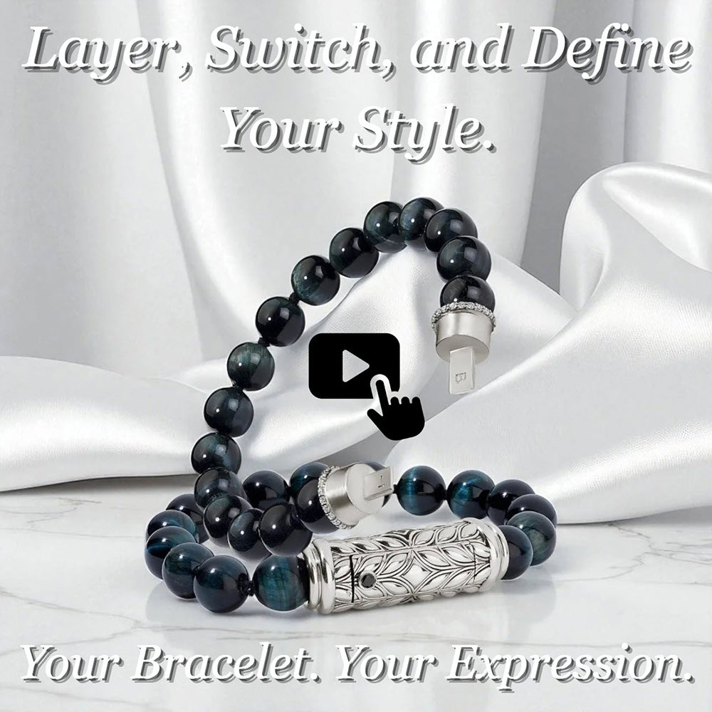 Blue Tiger Eye interchangeable bracelet with sculpted Persian Shield silver clasp and diamond accents, styled on white satin with tagline “Layer, Switch, and Define Your Style. Your Bracelet. Your Expression.”